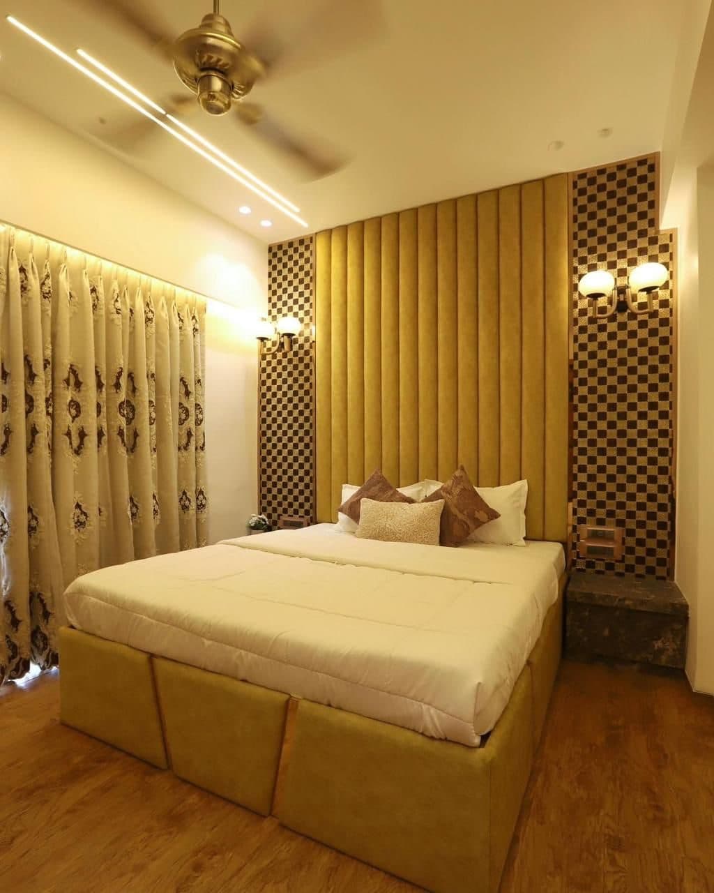 Bedroom with mustard tufted headboard