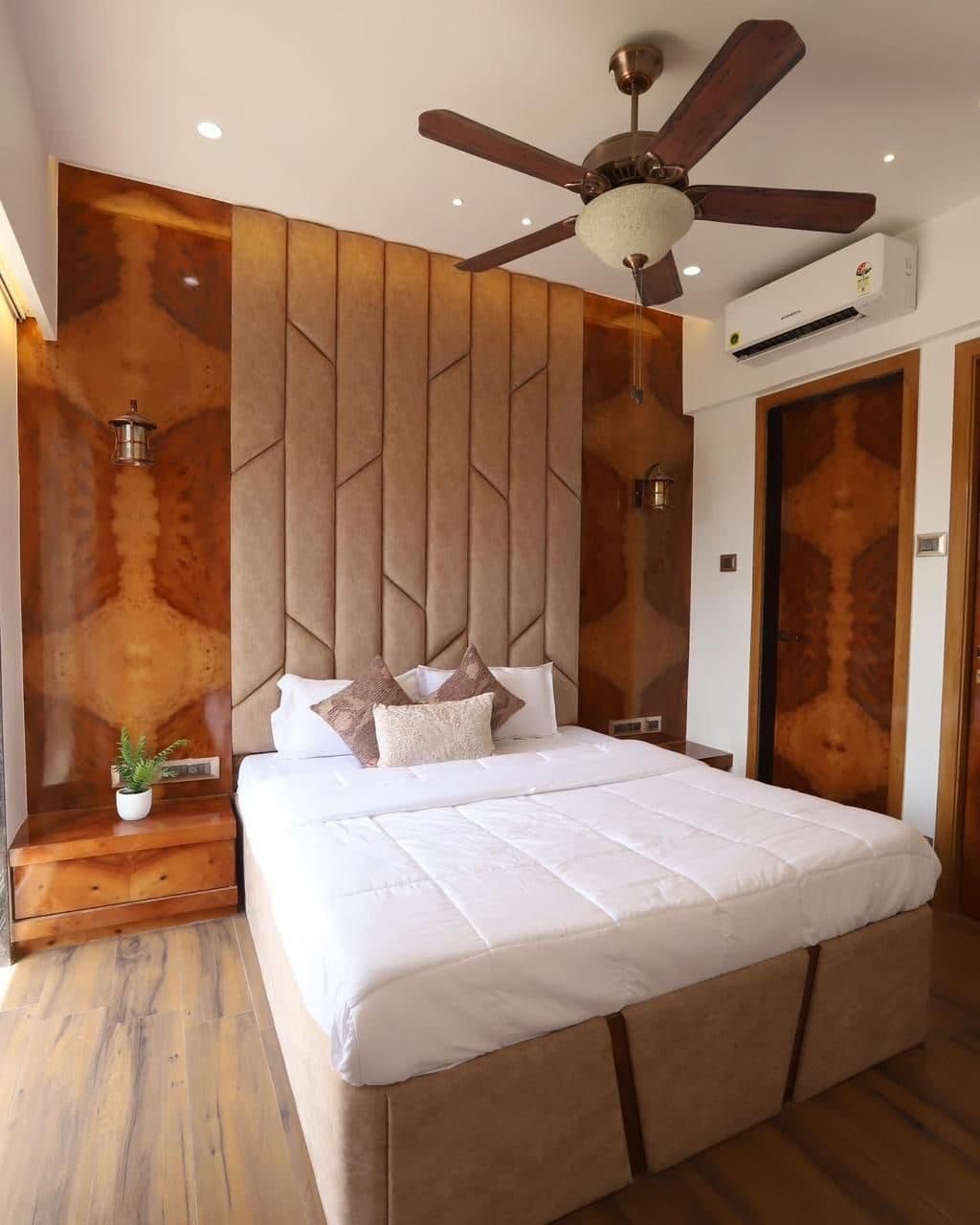 Bedroom with wood-panelled headboard wall