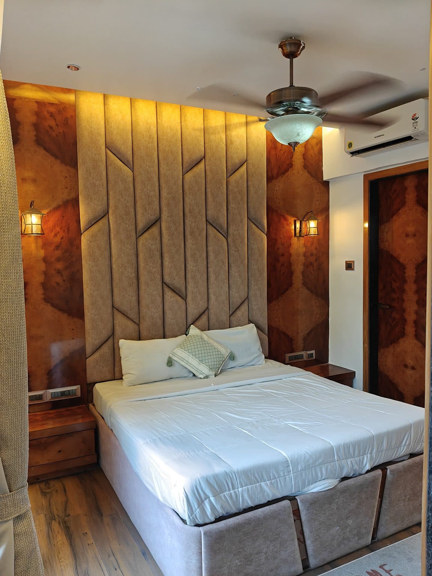 Bedroom with grey tufted headboard