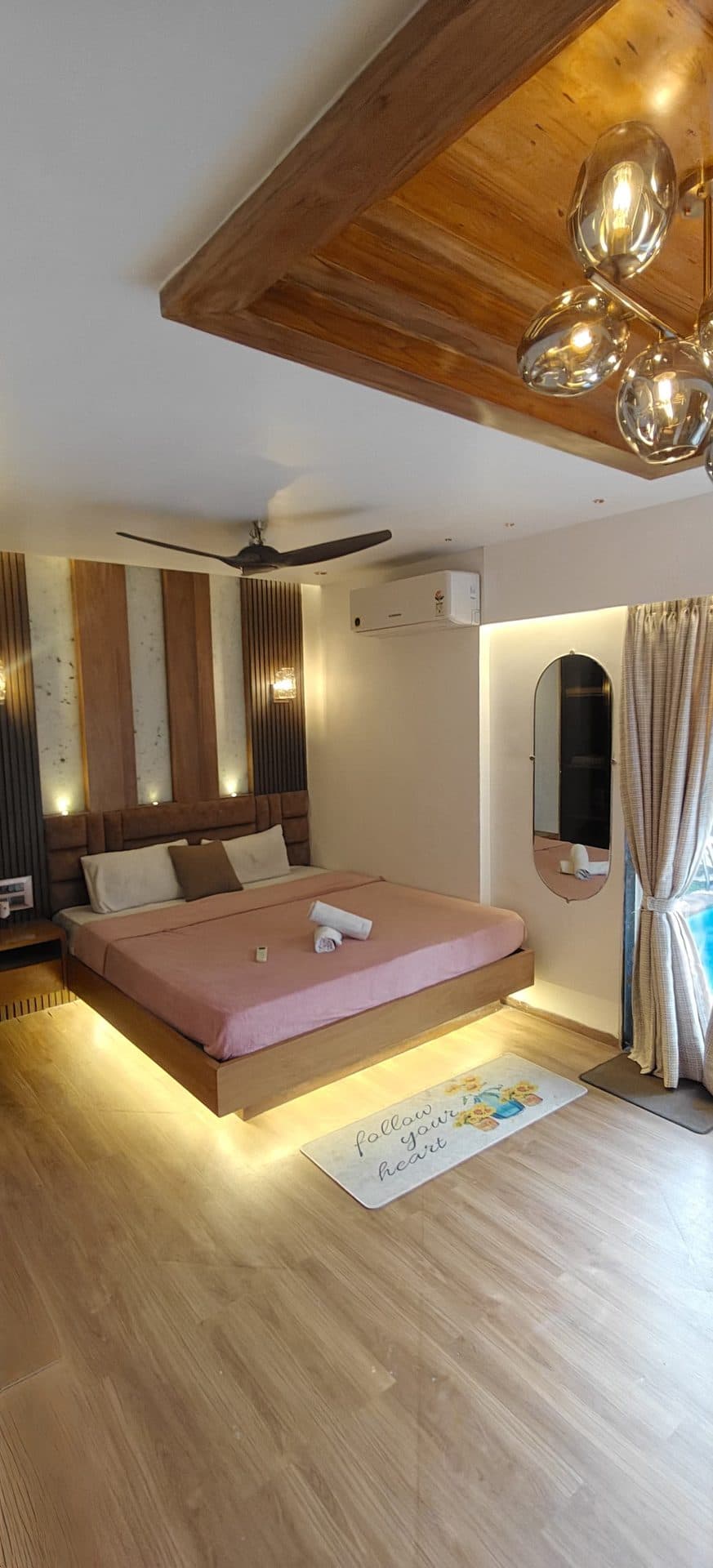 Bedroom with round pendant chandelier