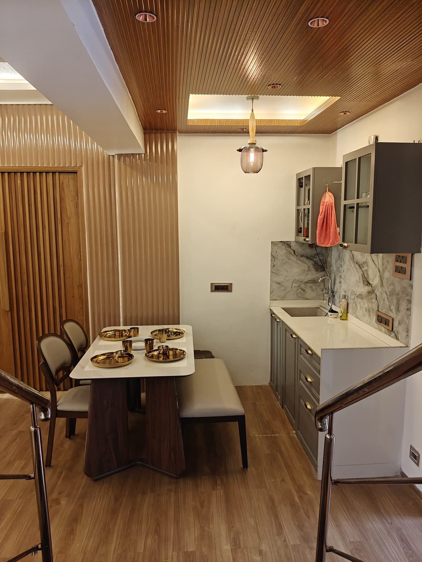 Kitchen with dining table by the staircase