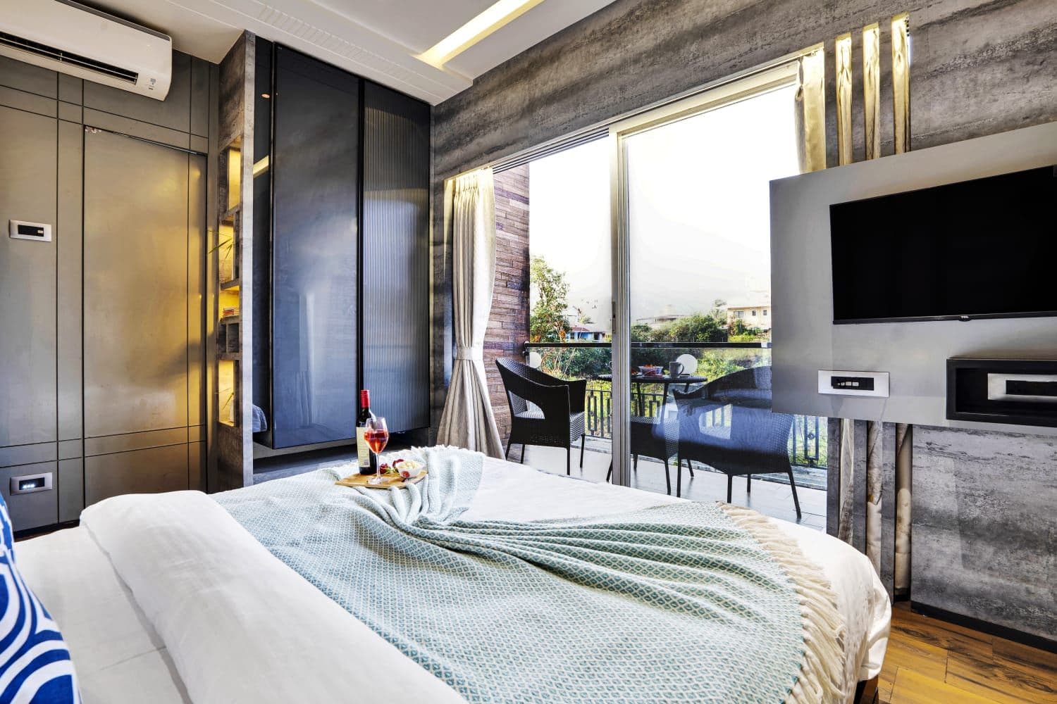 Bedroom with sliding doors opening to furnished balcony