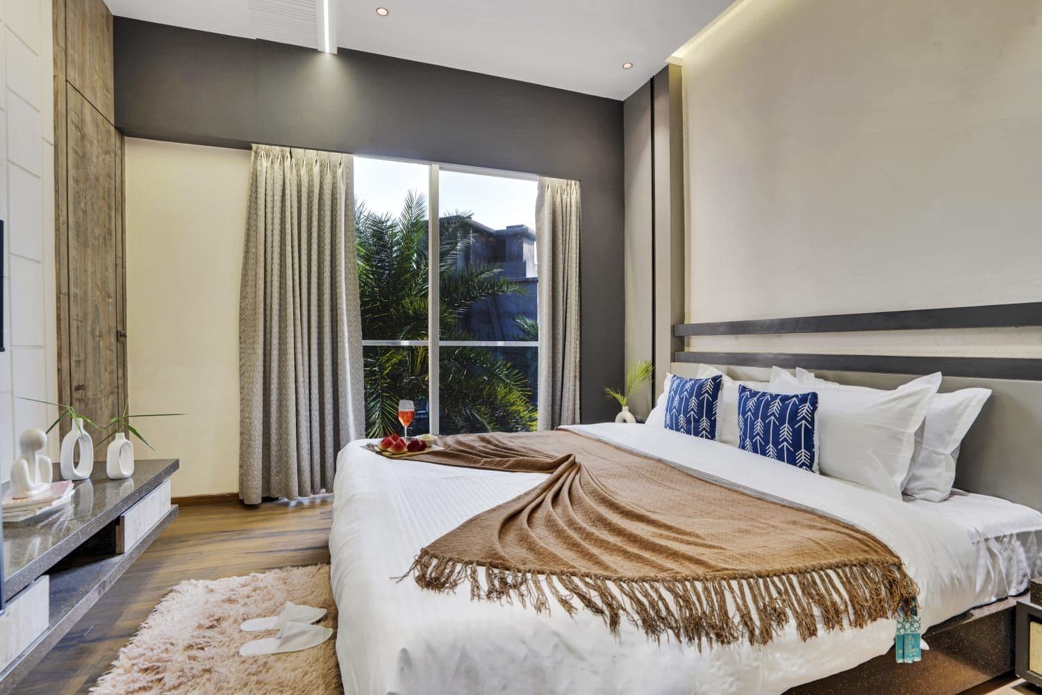 Bedroom with large window and soft natural light