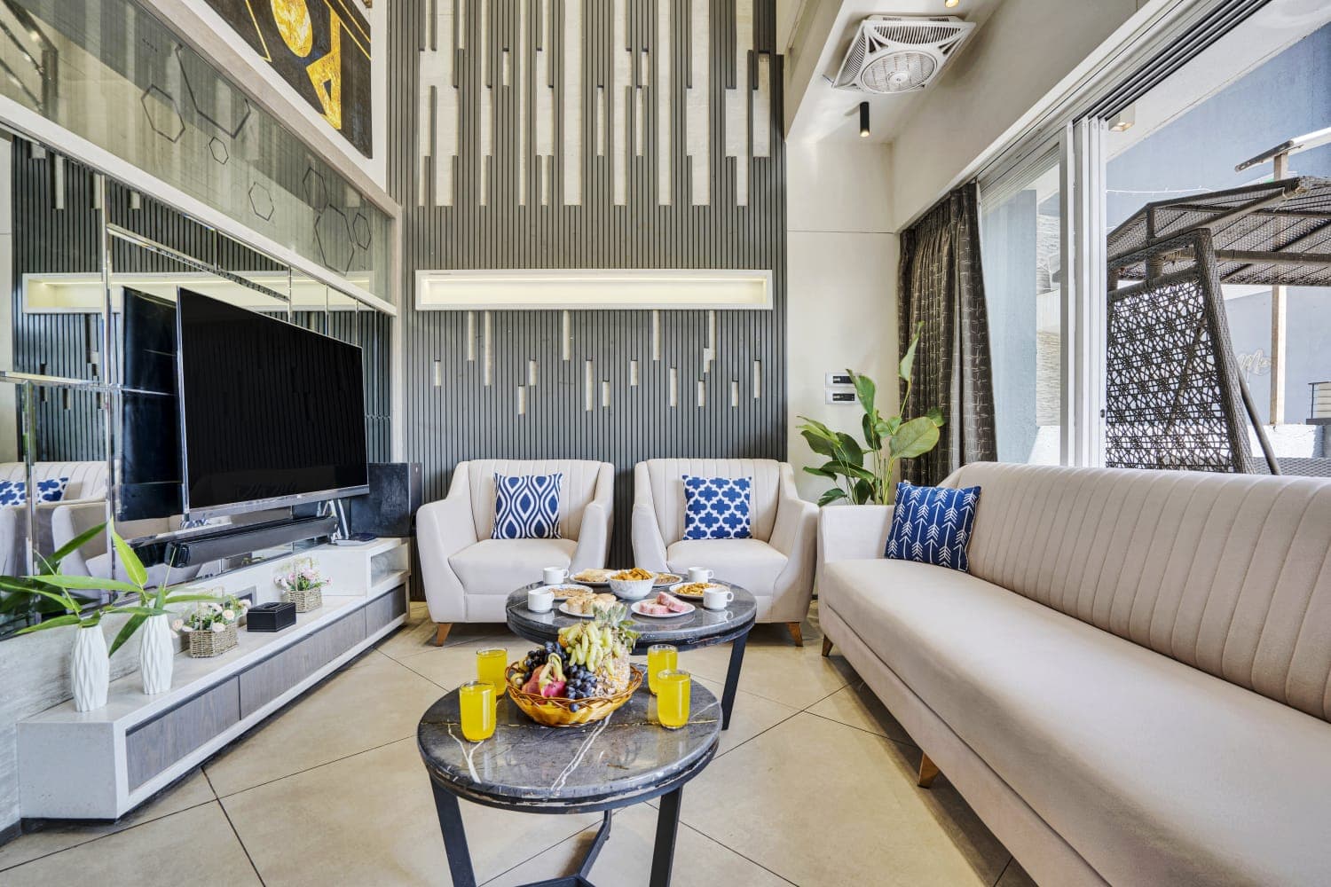 The double-height living room with curated furnishings
