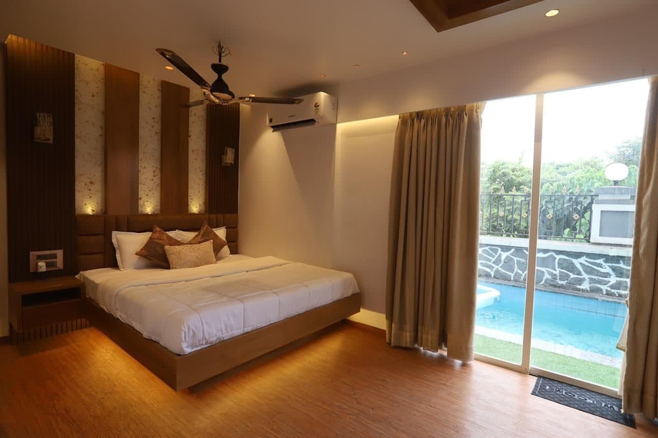 Bedroom with pool-facing sliding doors