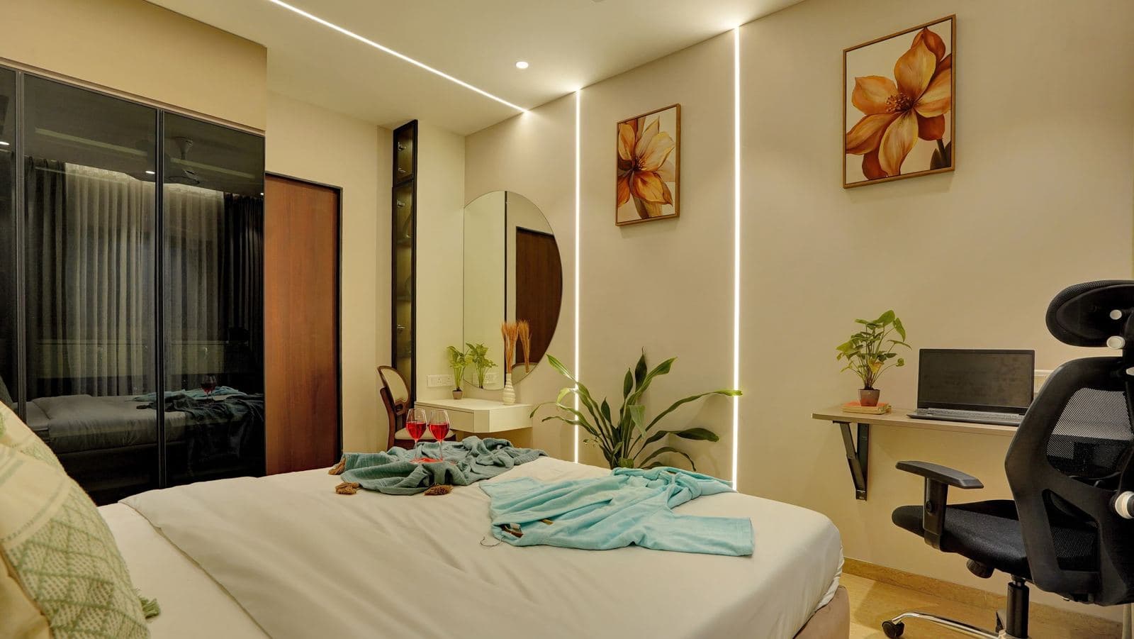 Bedroom with mirrored wardrobe, dressing mirror, and desk corner