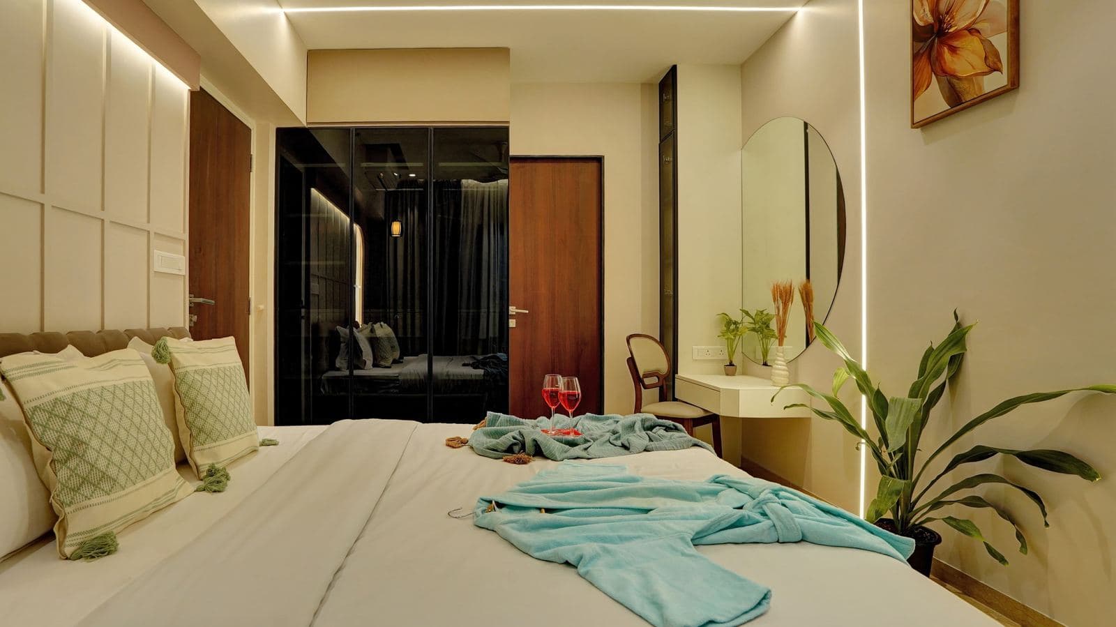 Bedroom with open wardrobe and dressing table